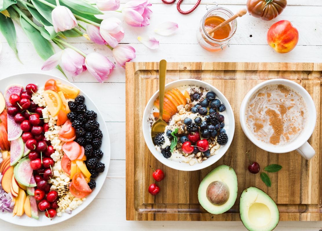 Person journaling their daily meals and nutrition tracking